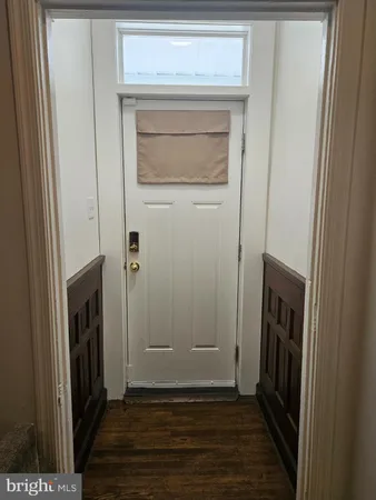 a view of a livingroom from a hallway