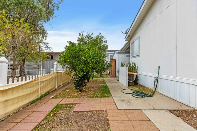 a view of a patio with chair and tables
