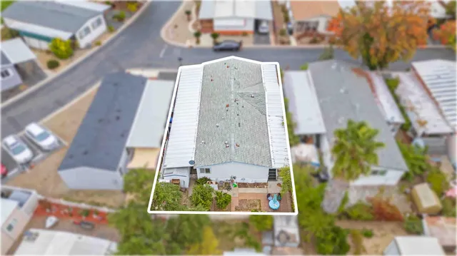 an aerial view of a residential apartment building with a yard