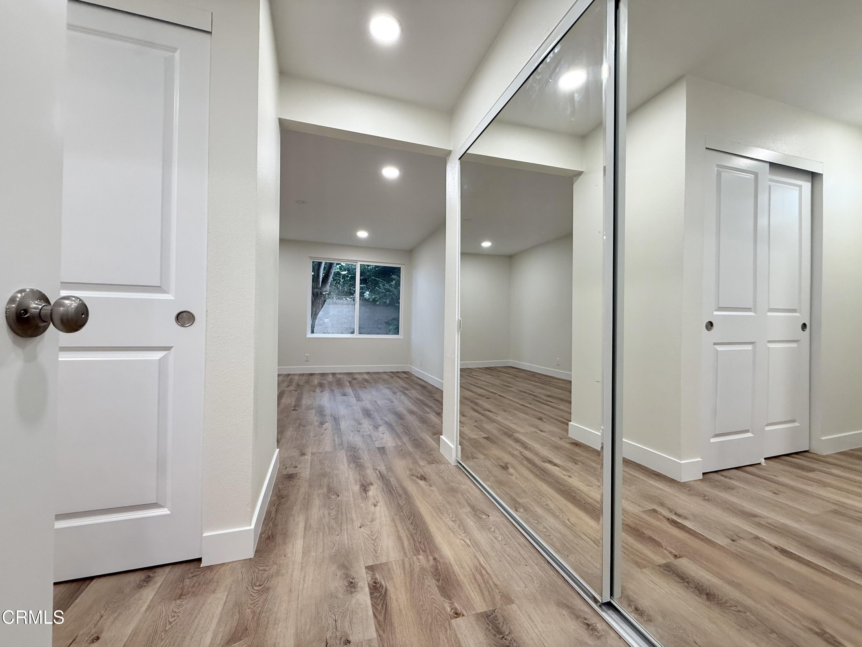 2124 Pamela Street Oxnard, CA 93036 - Photo 11 of 23 a view of a hallway with wooden floor