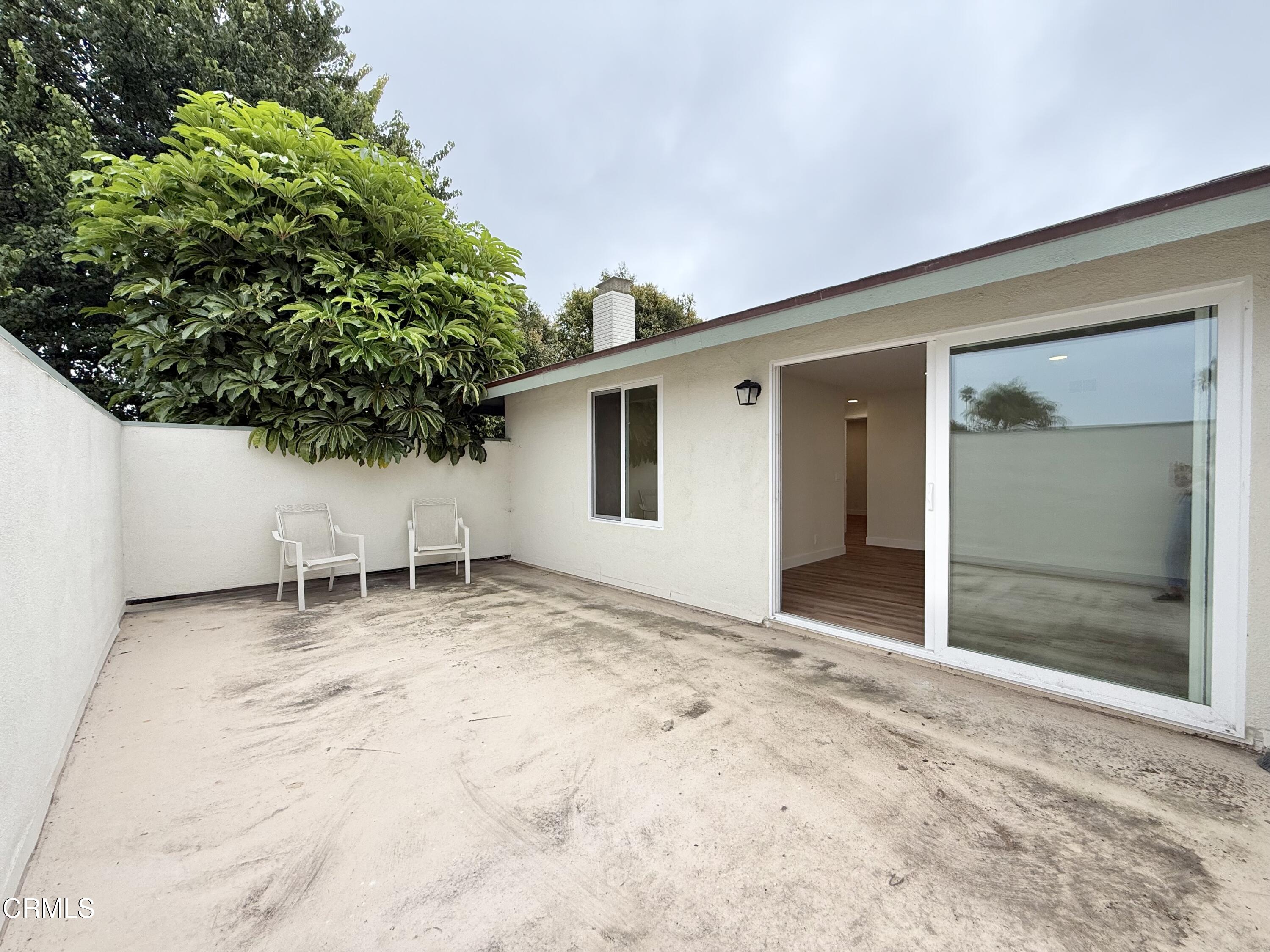 2124 Pamela Street Oxnard, CA 93036 - Photo 16 of 23 a view of an empty room with potted plants and wooden bench