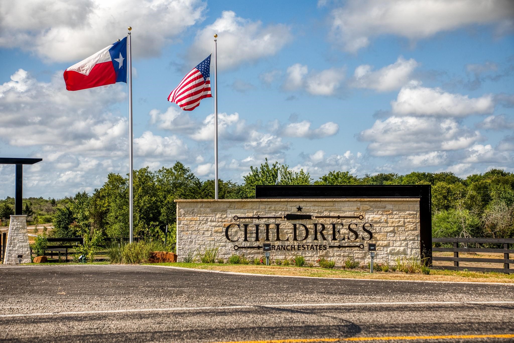 14804 Childress Rnch Drive Washington, TX 77880 - Photo 1 of 13 a view of a street with a building in the background