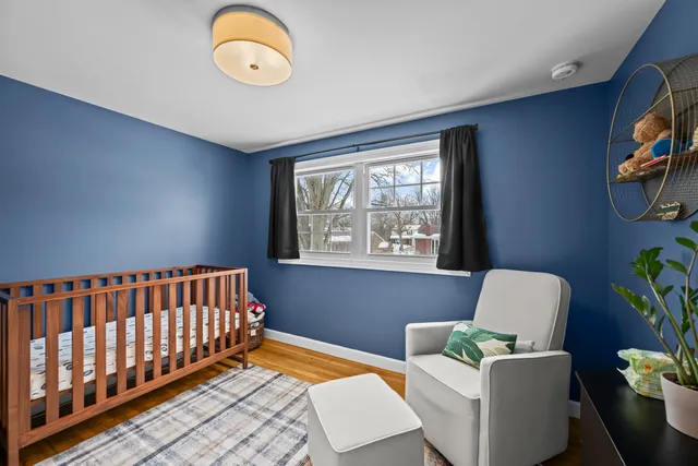 a bedroom with furniture and a window