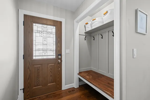 a view of room with windows and wooden floor