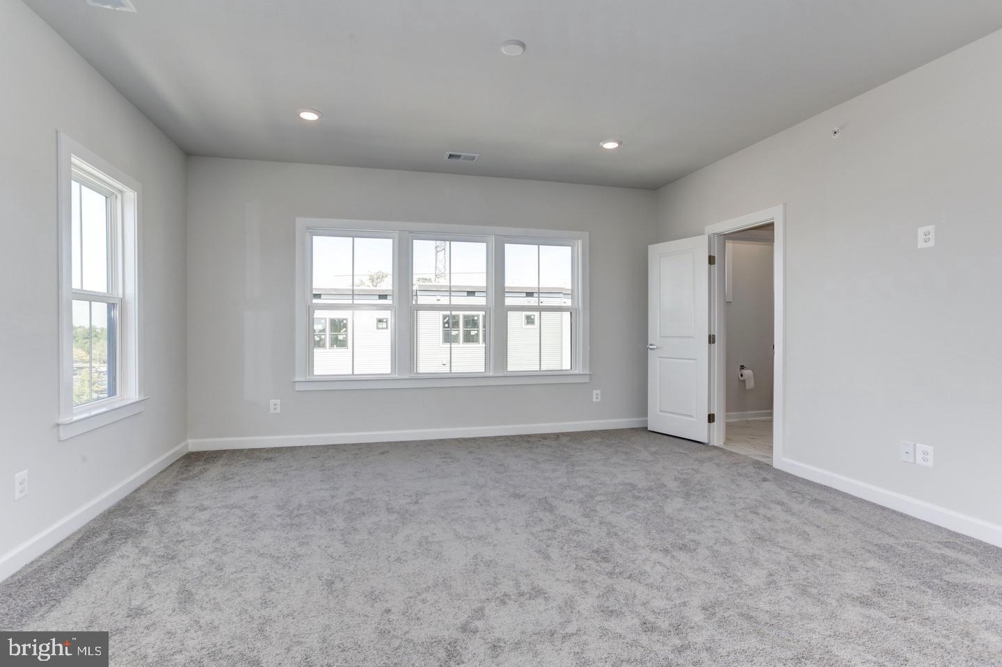 12923 Sunrise Ridge Alley Herndon, VA 20171 - Photo 12 of 25 a view of an empty room with a window