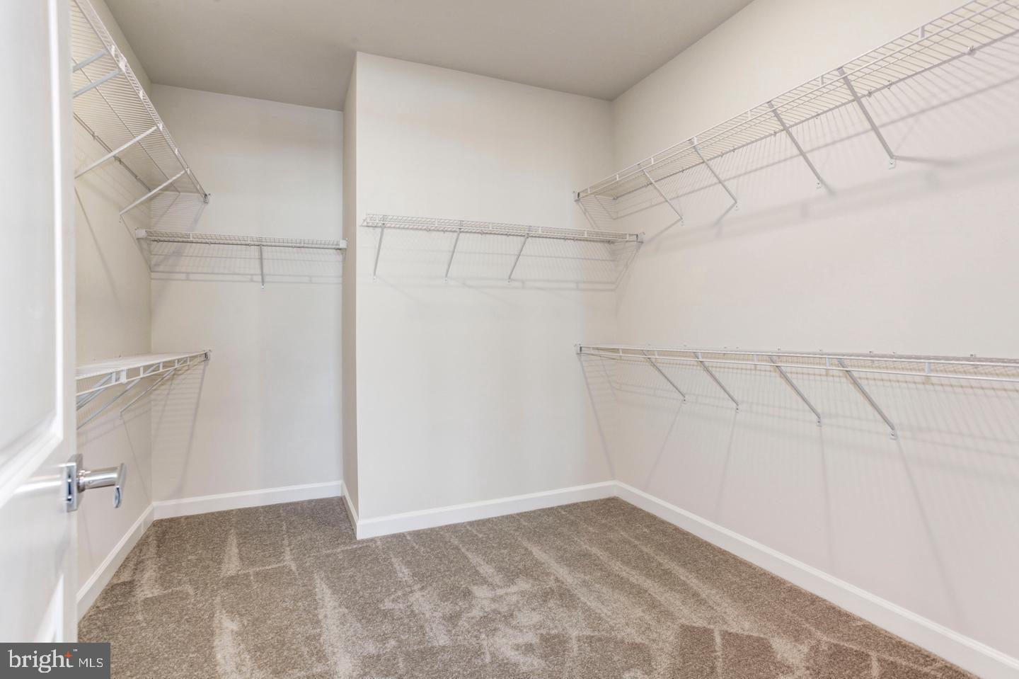 12923 Sunrise Ridge Alley Herndon, VA 20171 - Photo 18 of 25 a view of a room with racks on the wall