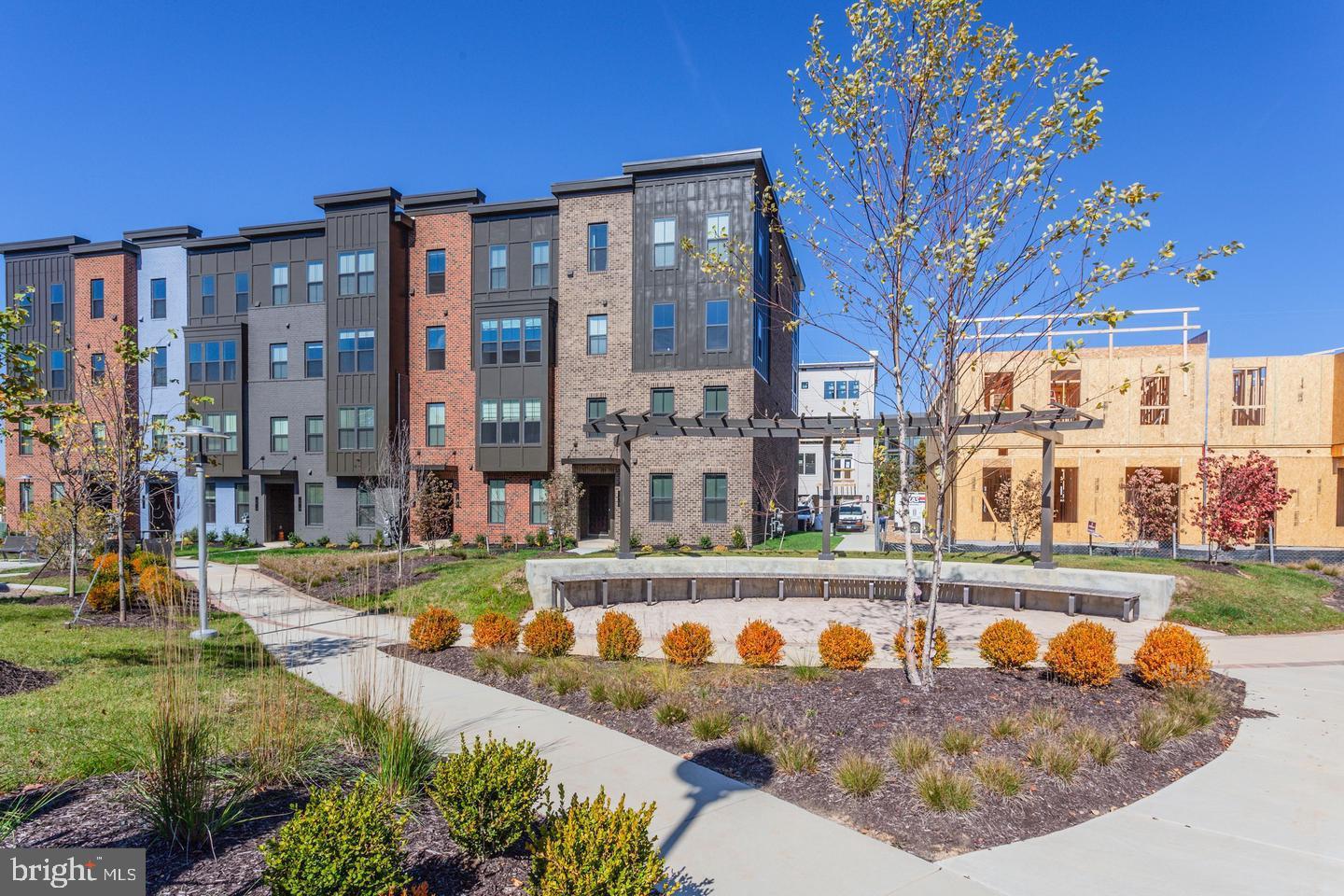 12923 Sunrise Ridge Alley Herndon, VA 20171 - Photo 25 of 25 front view of a building with a yard