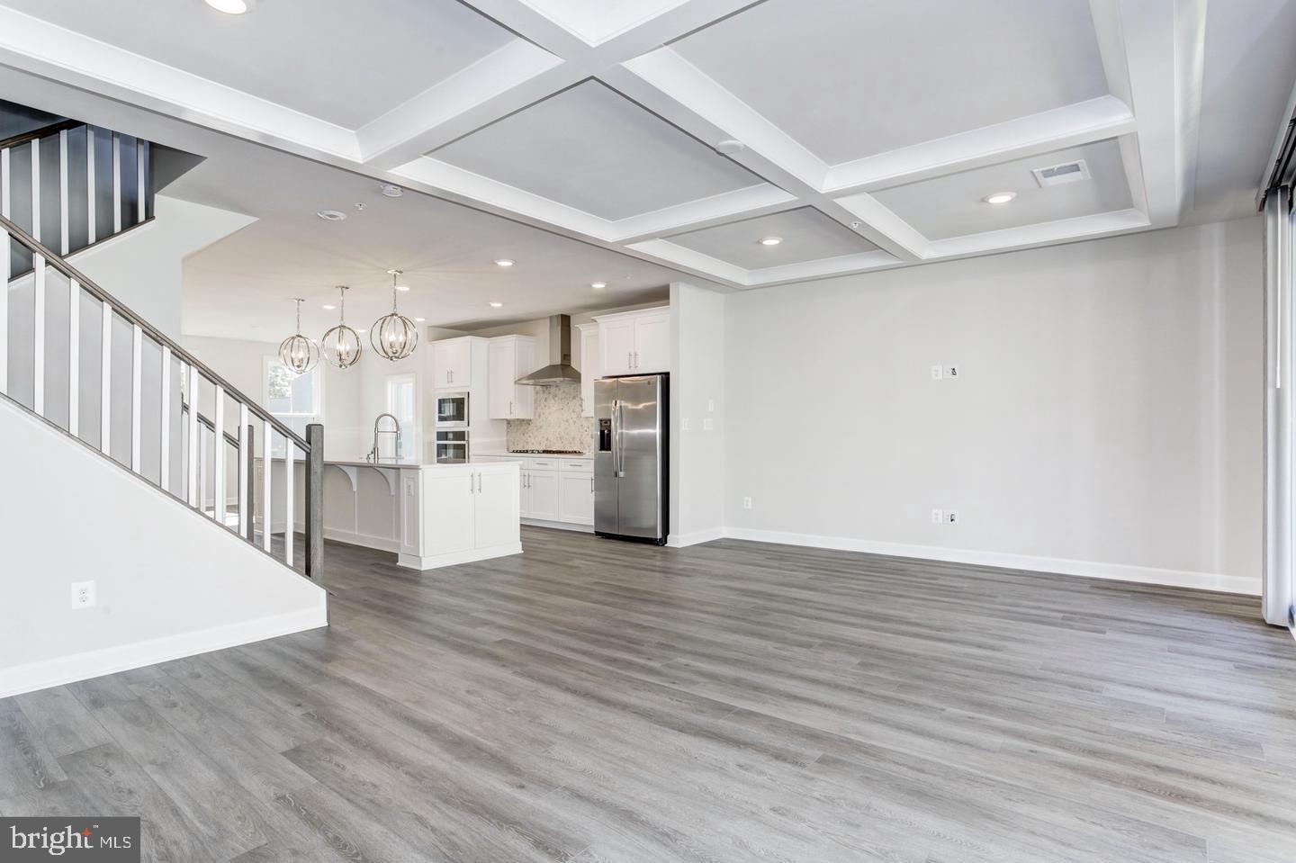 12923 Sunrise Ridge Alley Herndon, VA 20171 - Photo 5 of 25 a view of kitchen with wooden floor and electronic appliances