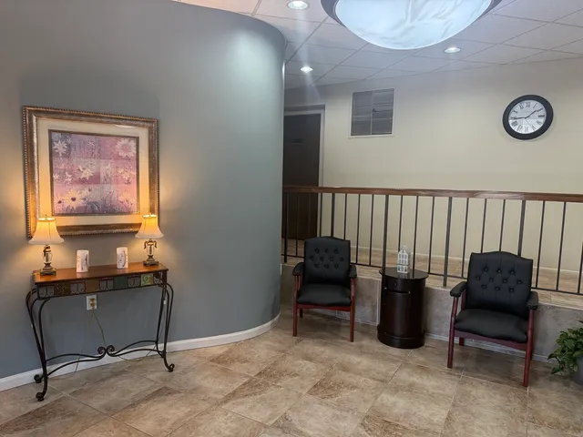 a view of workspace with furniture and window