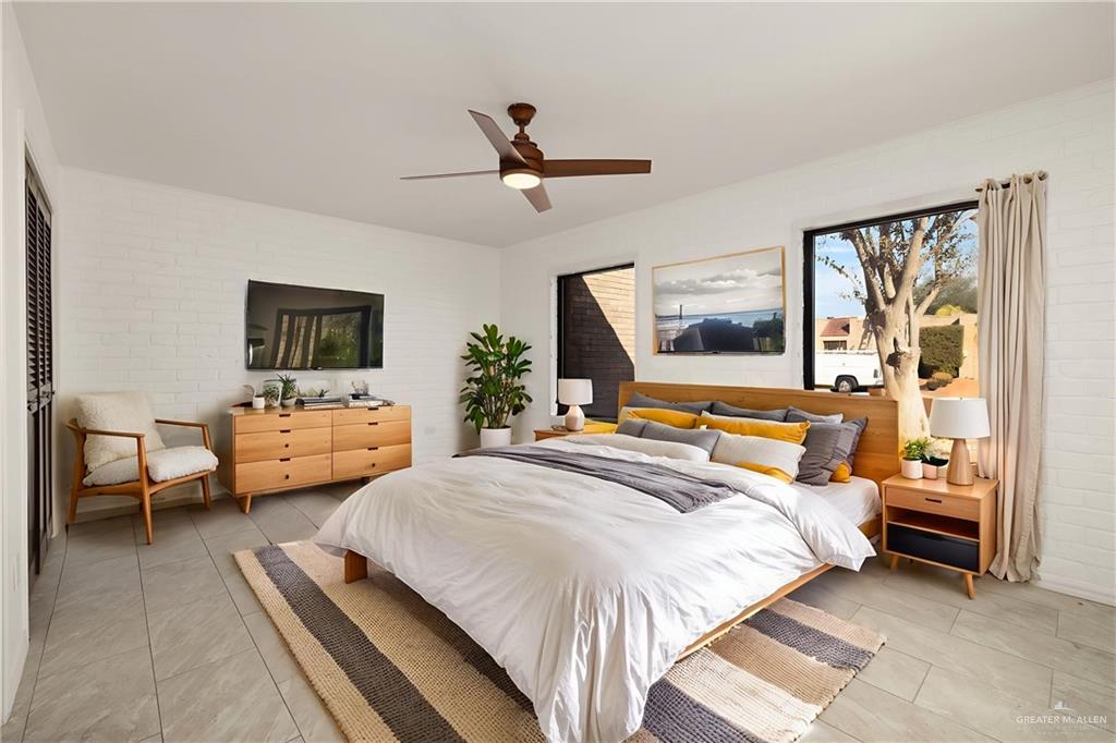 409 Tyler Avenue McAllen, TX 78503 - Photo 19 of 21 a bedroom with a bed couch and a window
