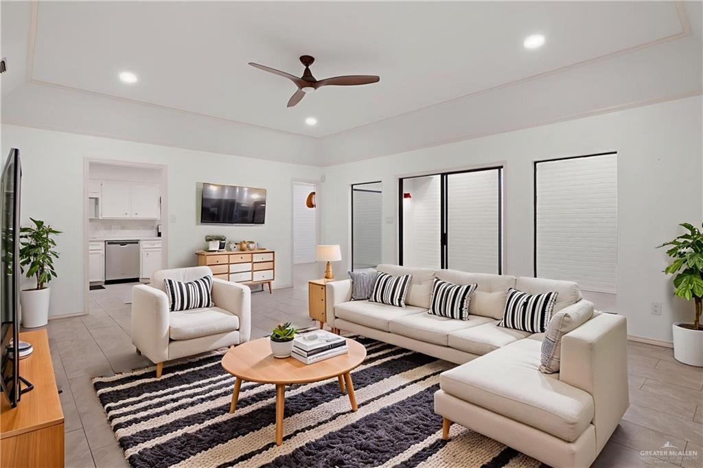 409 Tyler Avenue McAllen, TX 78503 - Photo 3 of 21 a living room with furniture or couch and a flat screen tv