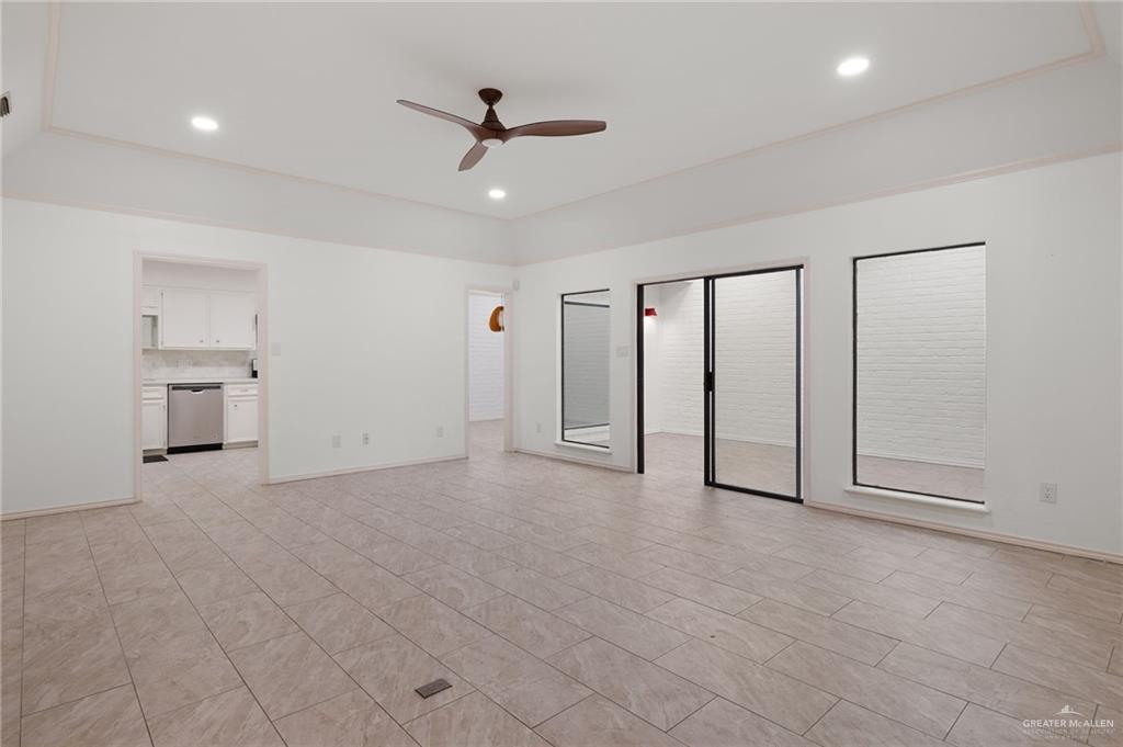 409 Tyler Avenue McAllen, TX 78503 - Photo 4 of 21 a view of an empty room with a window