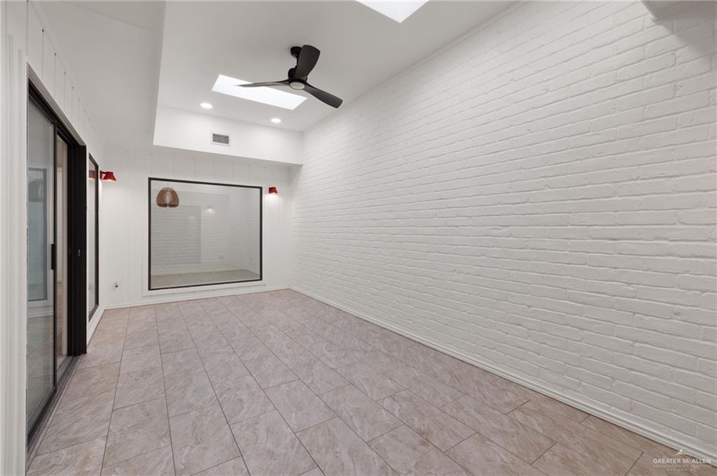 409 Tyler Avenue McAllen, TX 78503 - Photo 6 of 21 a view of empty room with a fan