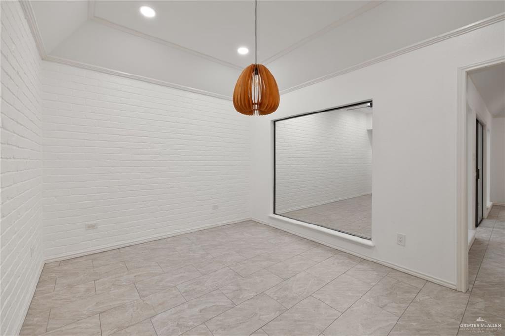 409 Tyler Avenue McAllen, TX 78503 - Photo 10 of 21 a view of an empty room with wooden floor