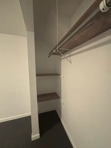 a view of an empty walk in closet