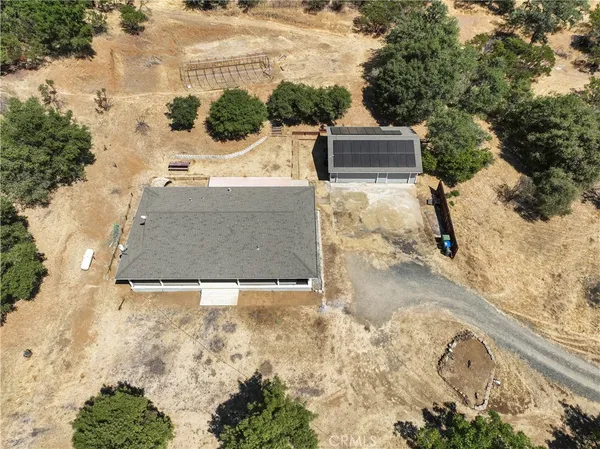 an aerial view of house with yard