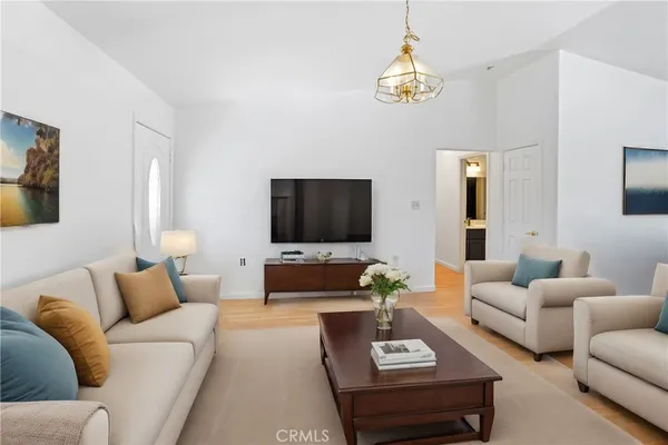 a living room with furniture and a flat screen tv