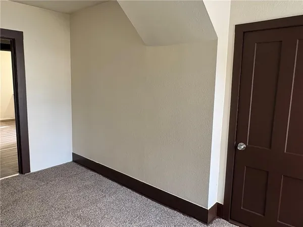 a view of hallway with closet