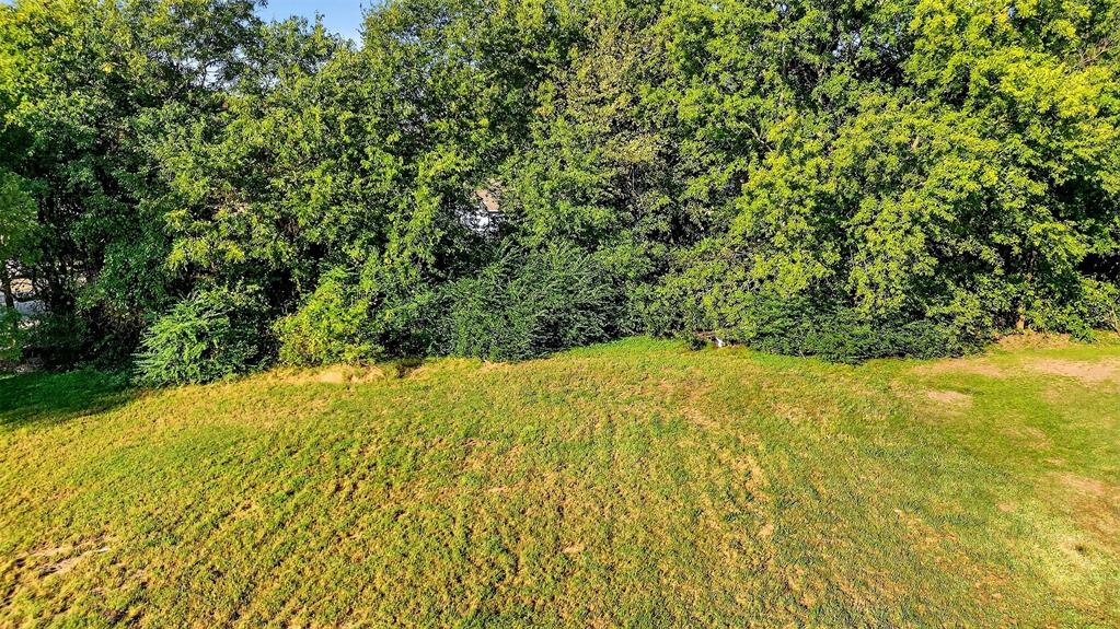 2018 South Inwood Street Sherman, TX 75090 - Photo 10 of 22 a view of a yard with a tree