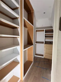 a bathroom with a tub shower and sink