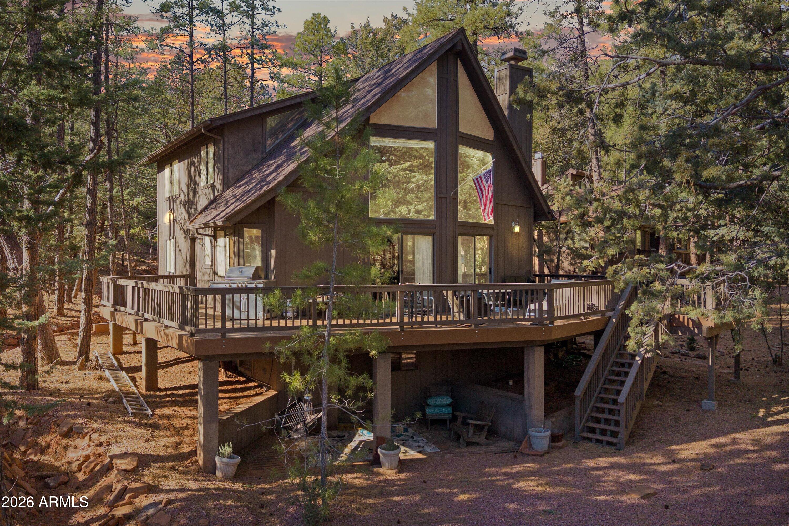 6181 Pinon Loop Pine, AZ 85544 - Photo 2 of 36 a front view of a house with sitting area