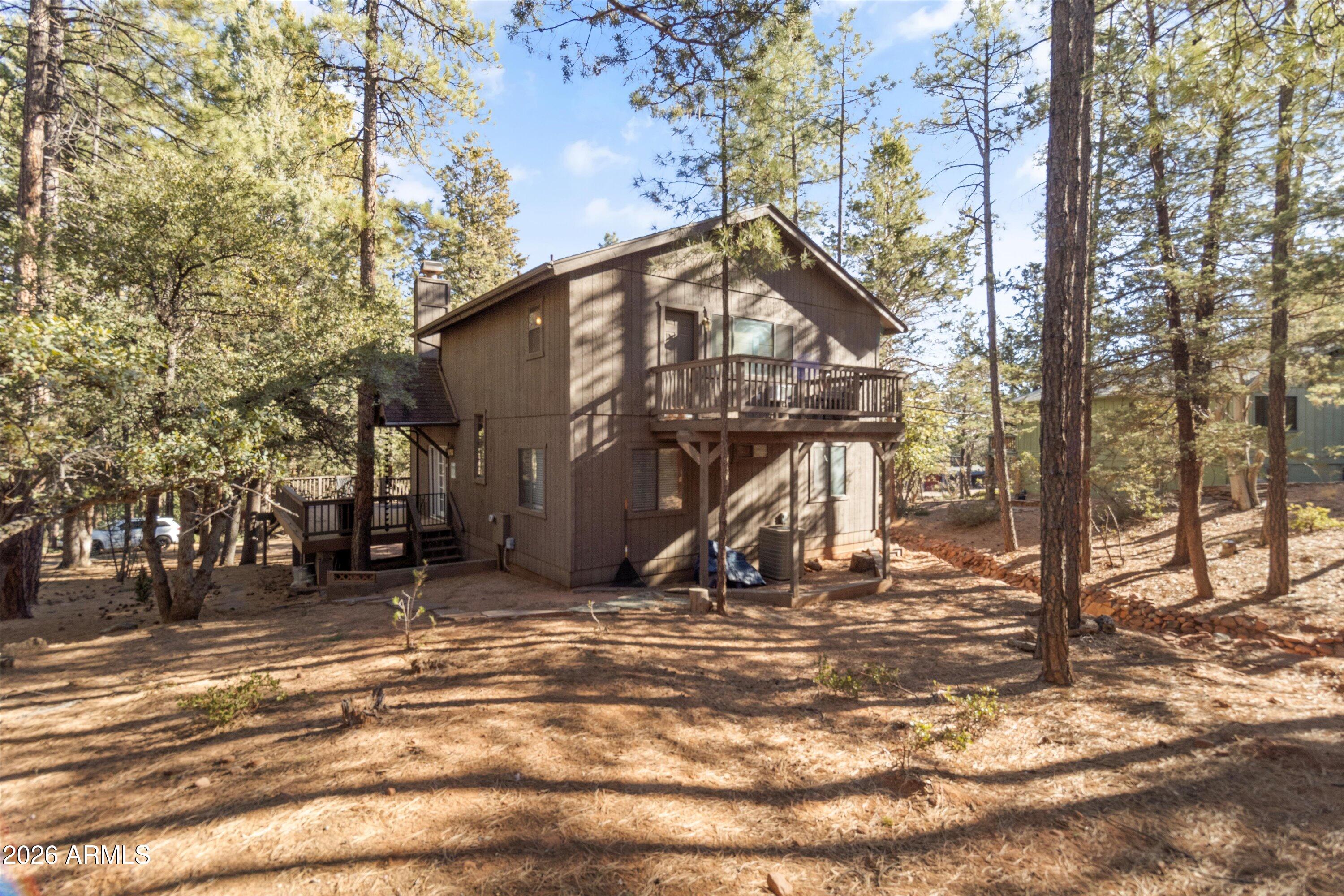 6181 Pinon Loop Pine, AZ 85544 - Photo 23 of 36 a view of a house with snow on the ground