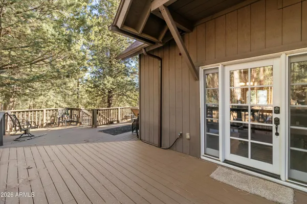 a view of trees from a balcony