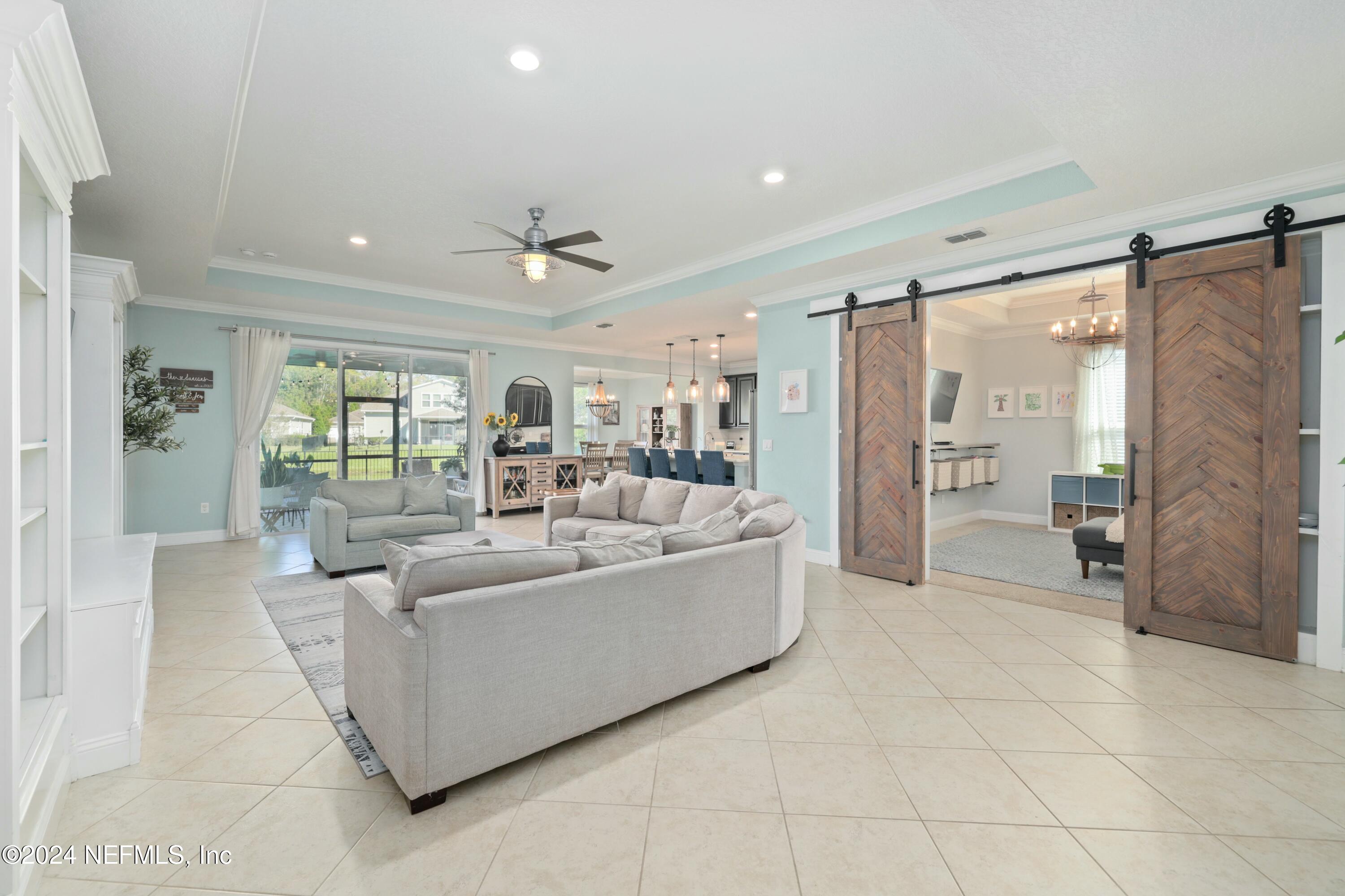404 St Kitts Loop St. Augustine, FL 32092 - Photo 15 of 68 a living room with furniture and a large window