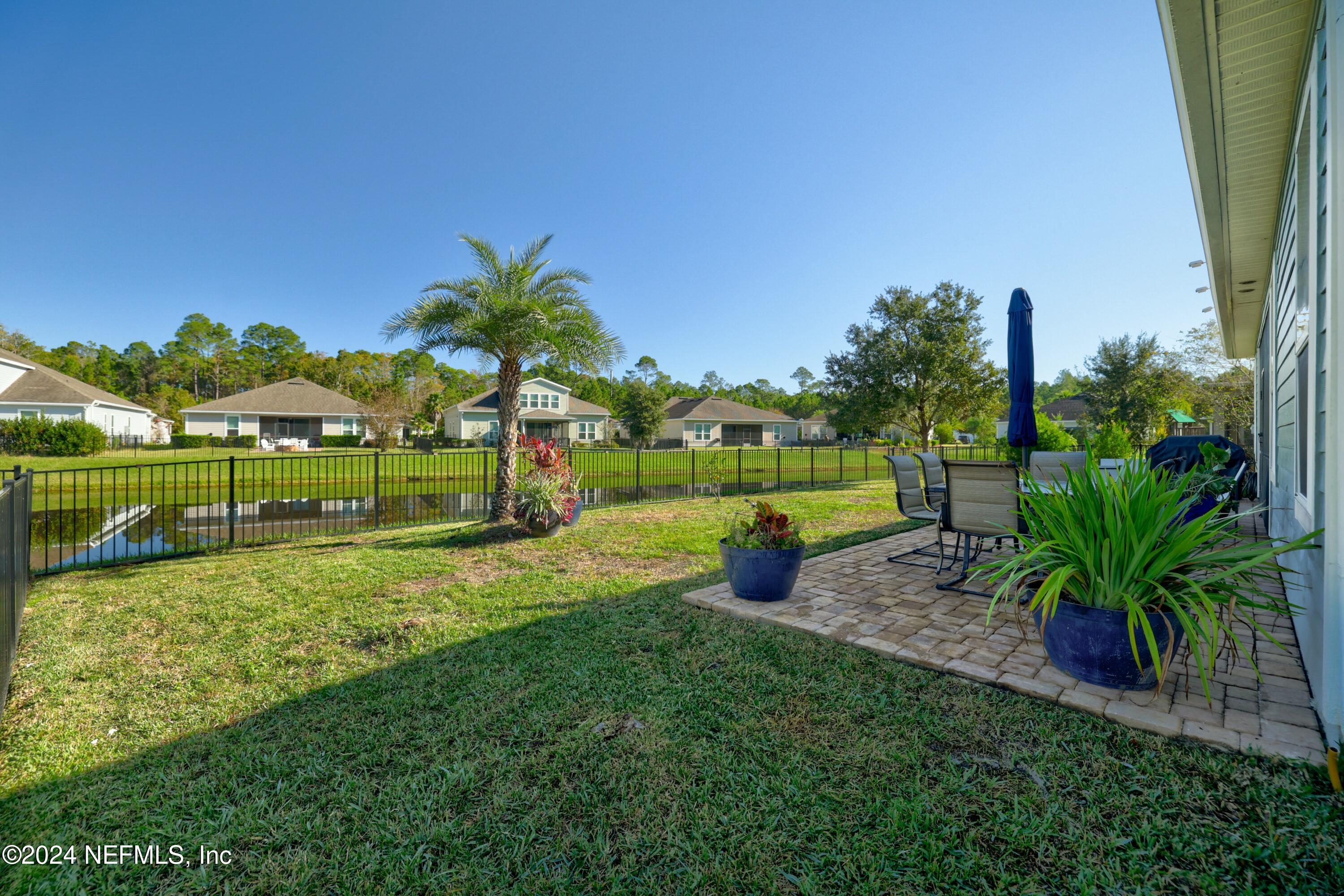 404 St Kitts Loop St. Augustine, FL 32092 - Photo 27 of 68 a view of a garden with a tree