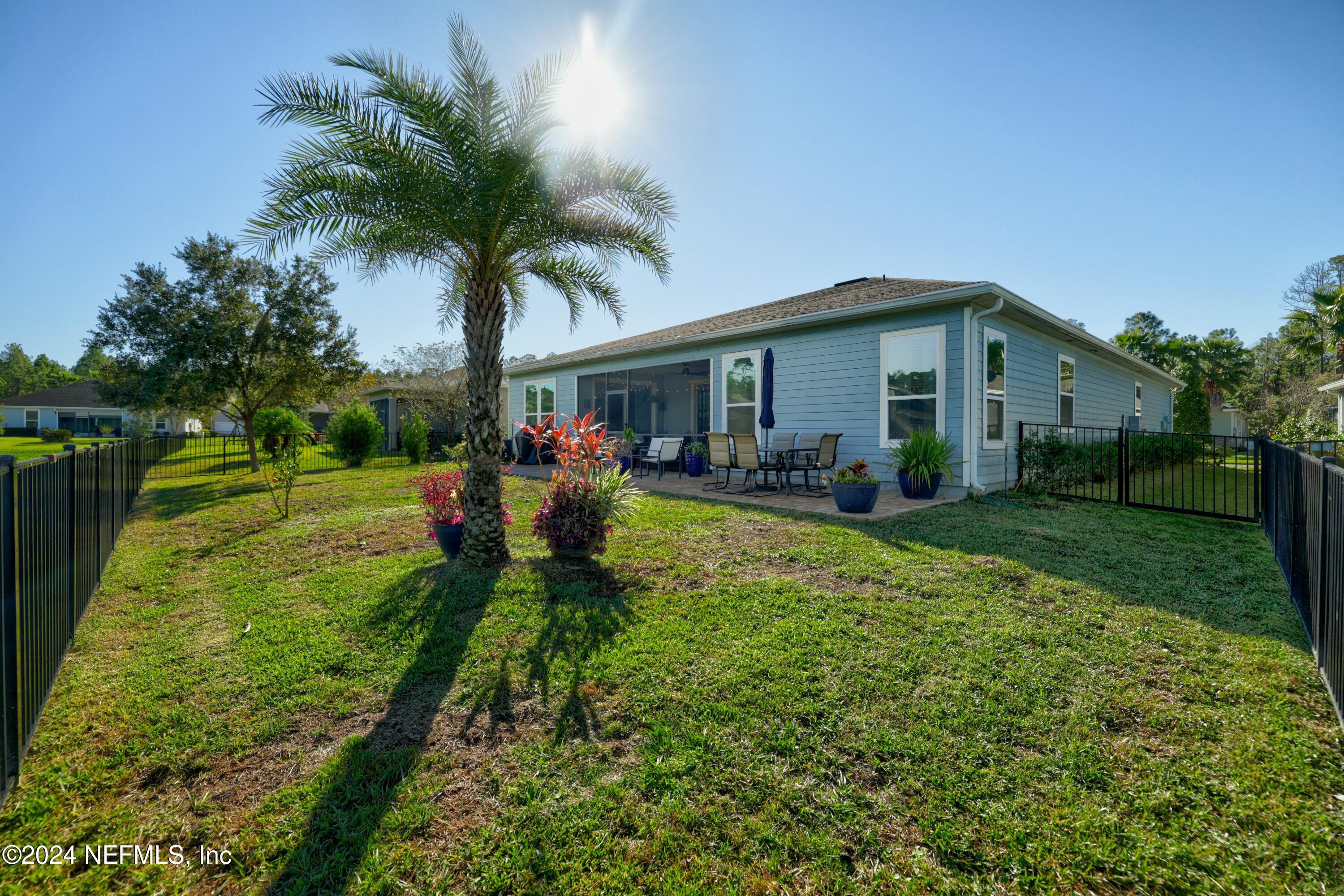 404 St Kitts Loop St. Augustine, FL 32092 - Photo 28 of 68 a front view of house with yard and outdoor seating