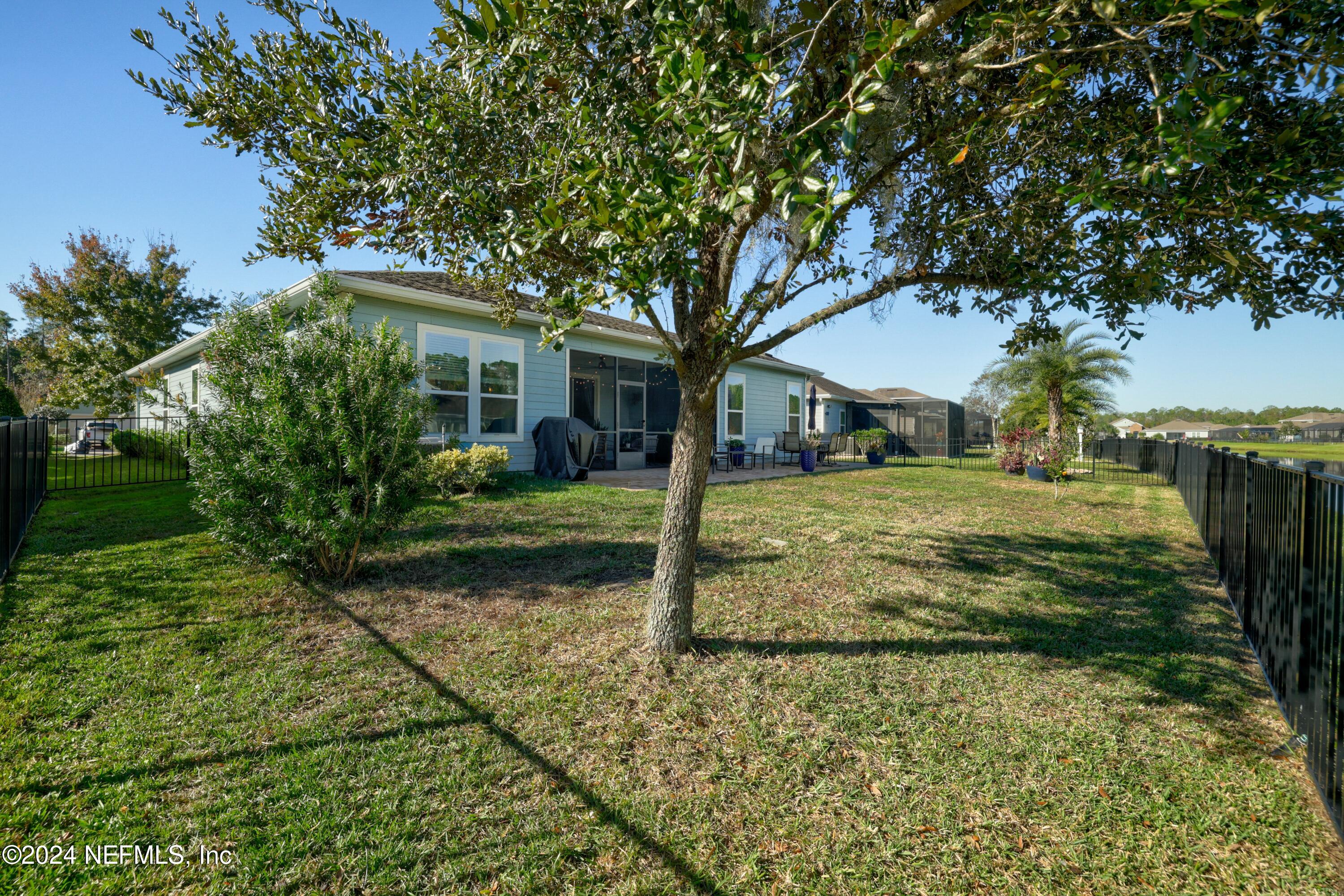 404 St Kitts Loop St. Augustine, FL 32092 - Photo 35 of 68 a view of a house with a yard