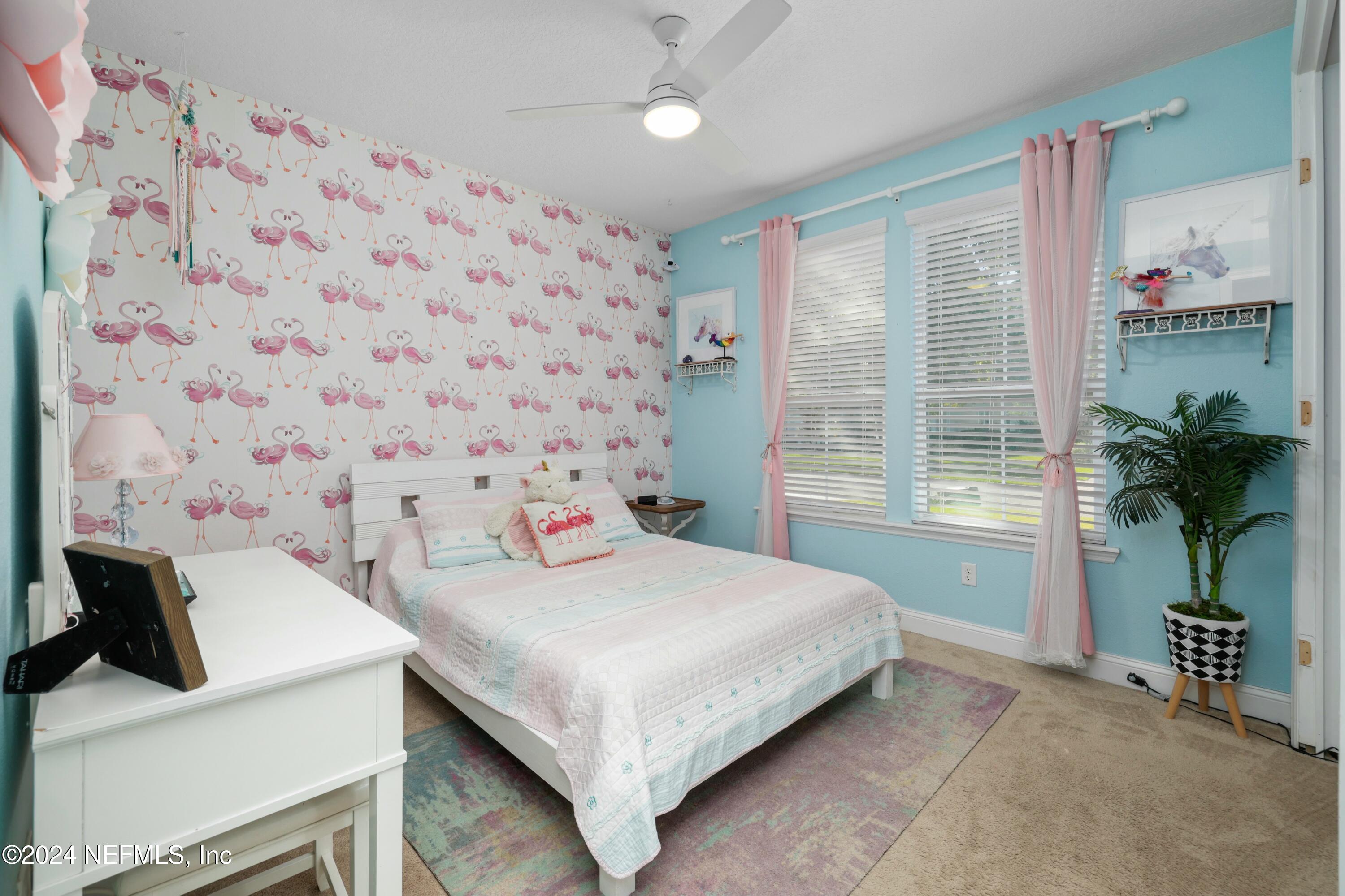 404 St Kitts Loop St. Augustine, FL 32092 - Photo 38 of 68 a bedroom with a bed and a potted plant