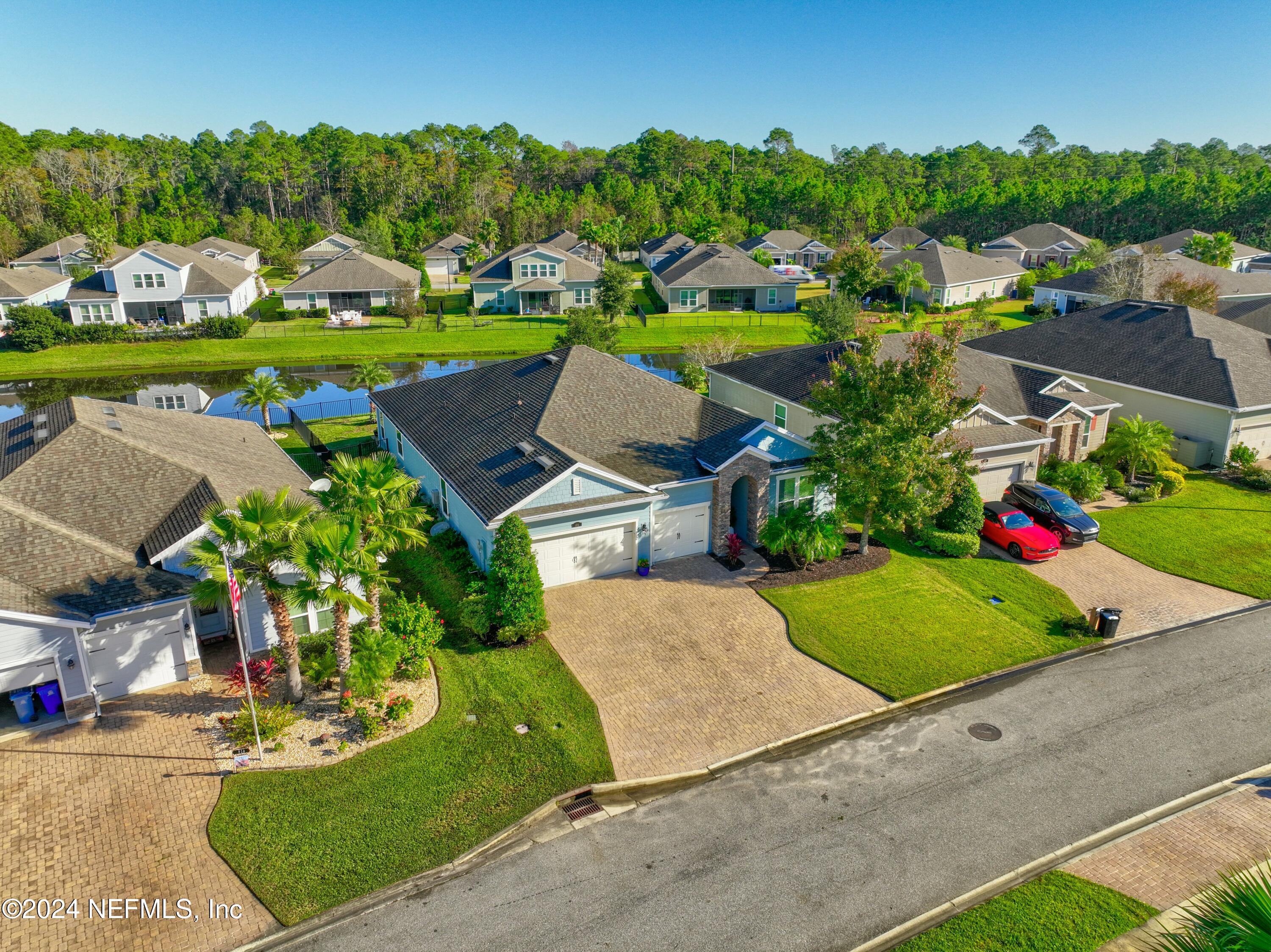 404 St Kitts Loop St. Augustine, FL 32092 - Photo 46 of 68 an aerial view of a house with garden space and street view