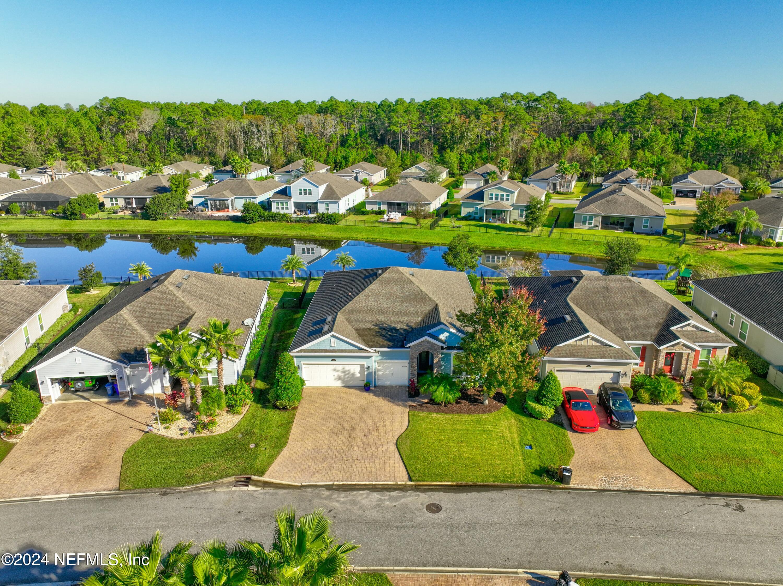 404 St Kitts Loop St. Augustine, FL 32092 - Photo 48 of 68 an aerial view of a house with a garden and yard