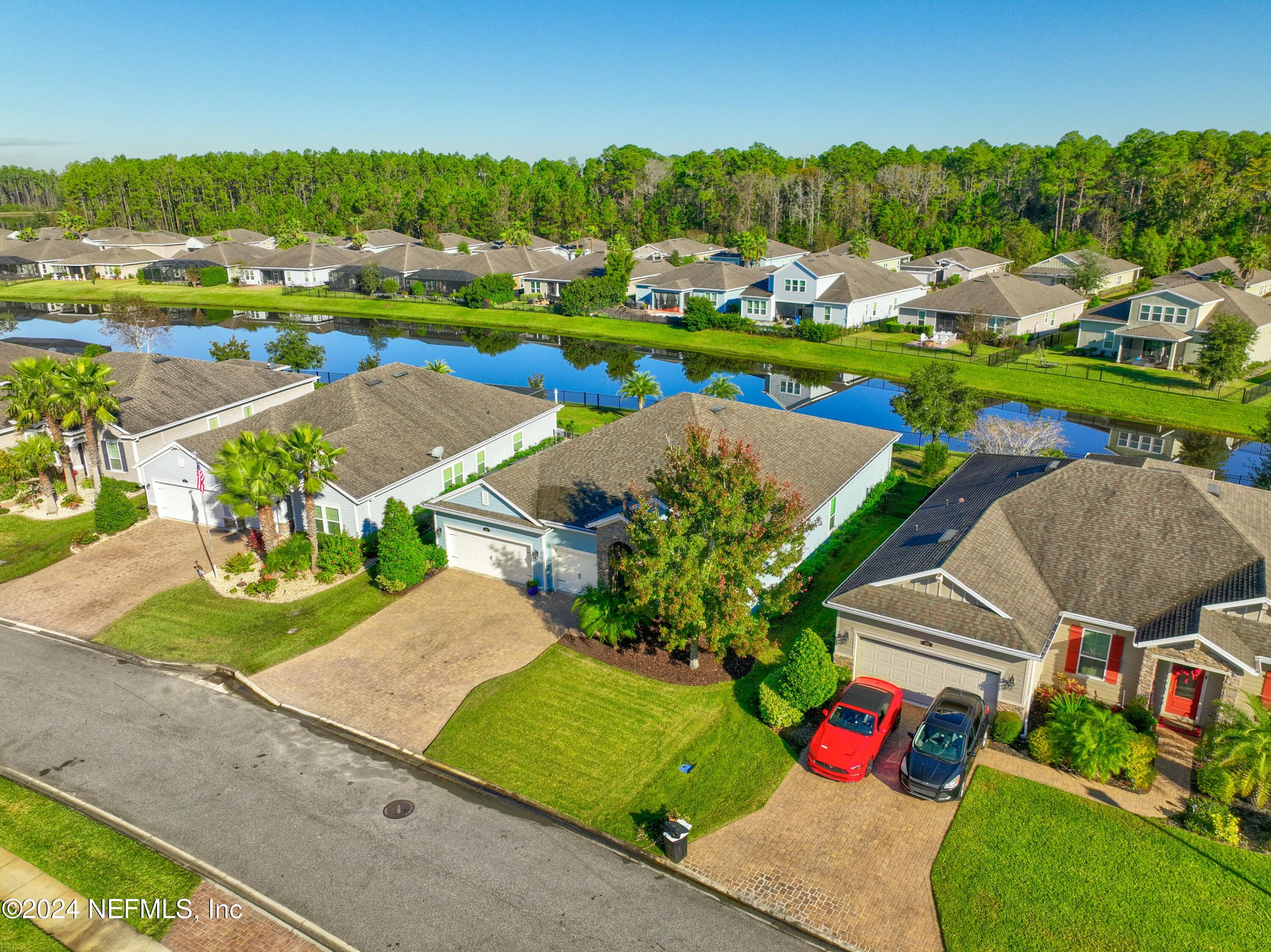 404 St Kitts Loop St. Augustine, FL 32092 - Photo 49 of 68 an aerial view of a pool yard and mountain view in back