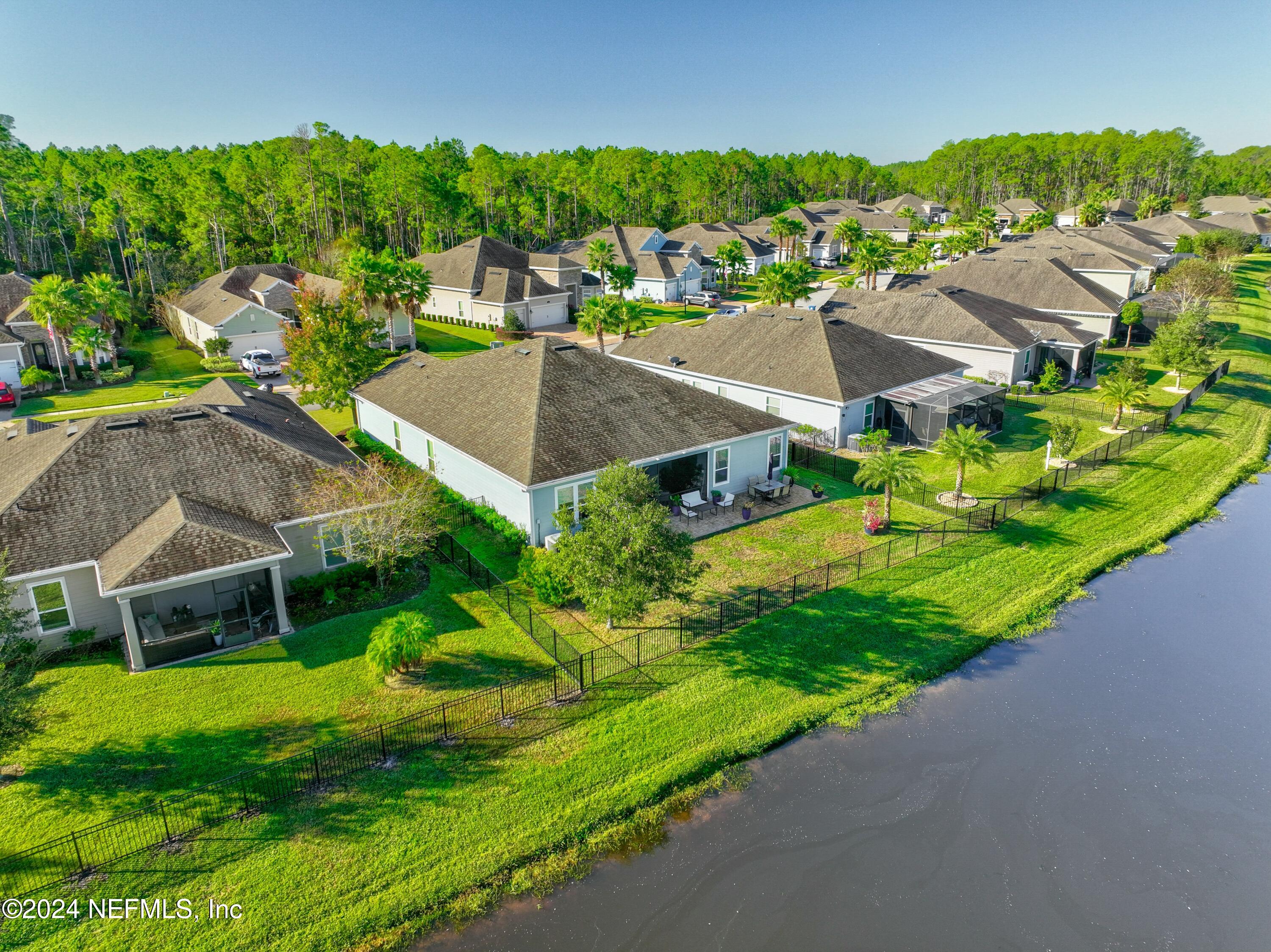 404 St Kitts Loop St. Augustine, FL 32092 - Photo 51 of 68 an aerial view of a house with a garden