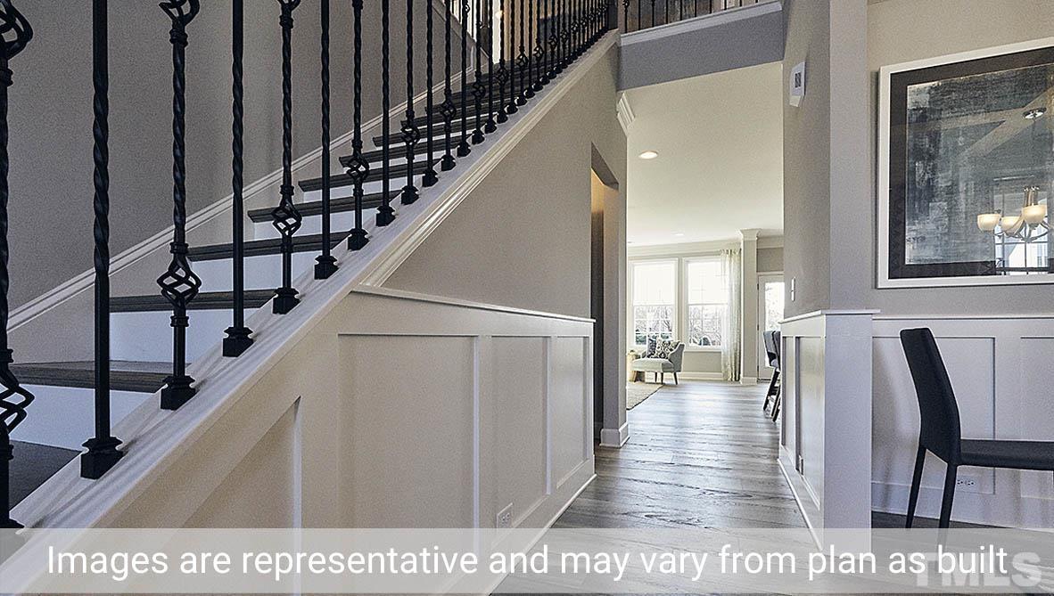 5037 Chase Hill Way Raleigh, NC 27603 - Photo 24 of 41 a view of entryway and hall with wooden floor