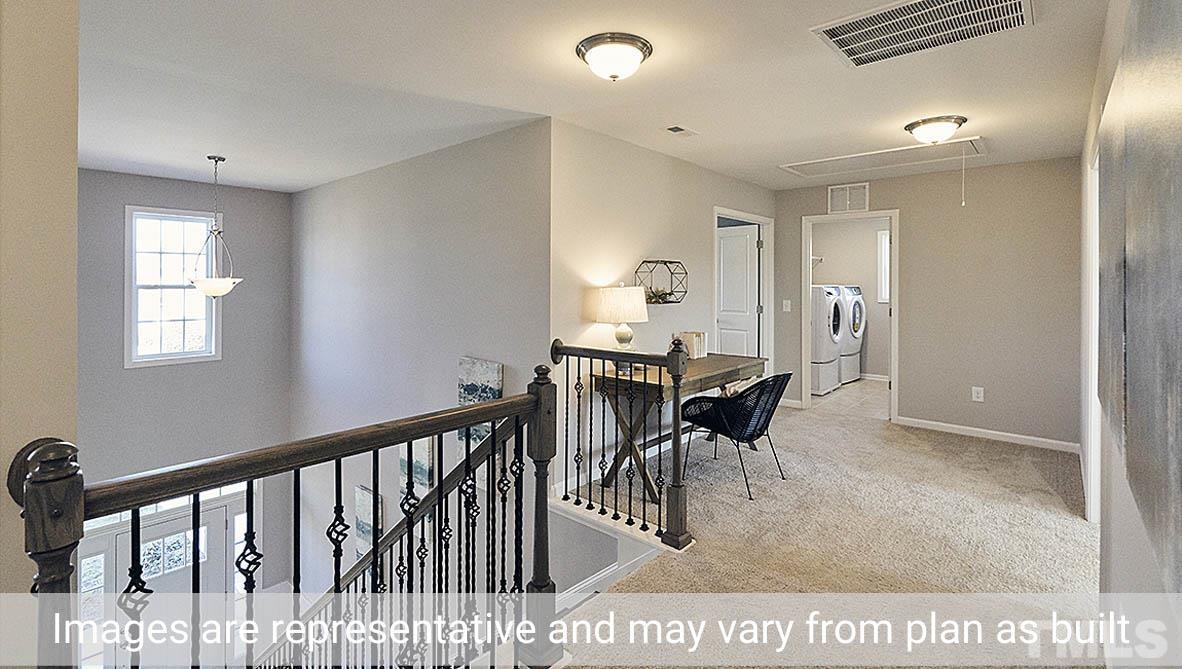 5037 Chase Hill Way Raleigh, NC 27603 - Photo 29 of 41 a dining room with furniture and a window