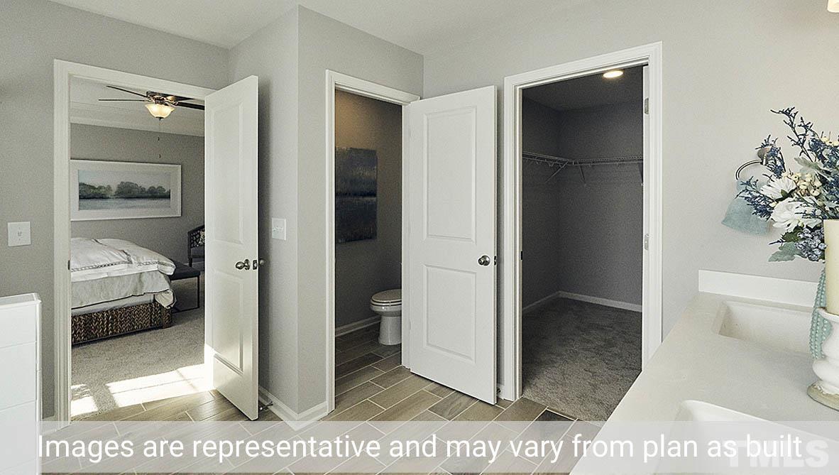 5037 Chase Hill Way Raleigh, NC 27603 - Photo 35 of 41 a view of a bathroom from a hallway