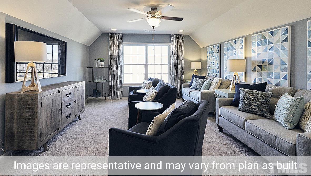 5037 Chase Hill Way Raleigh, NC 27603 - Photo 37 of 41 a living room with furniture and a large window