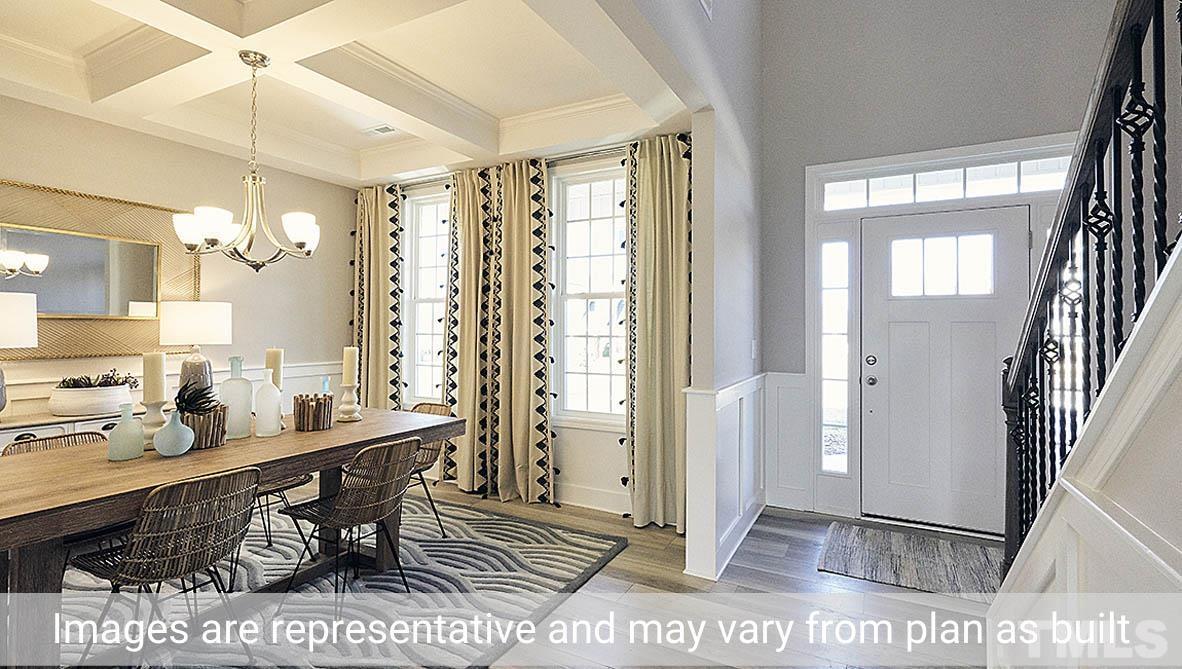 5037 Chase Hill Way Raleigh, NC 27603 - Photo 6 of 41 a view of a very nice looking dining room with furniture and a window
