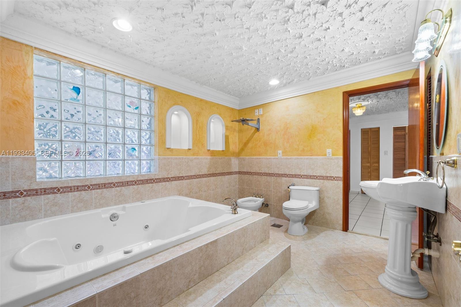 11620 Southwest 179th Terrace Miami, FL 33157 - Photo 15 of 25 a bathroom with a bathtub and a shower