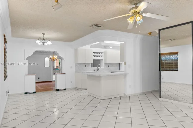 a view of a house with porch and garden