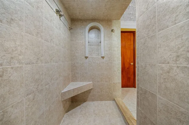a bathroom with a toilet sink and shower
