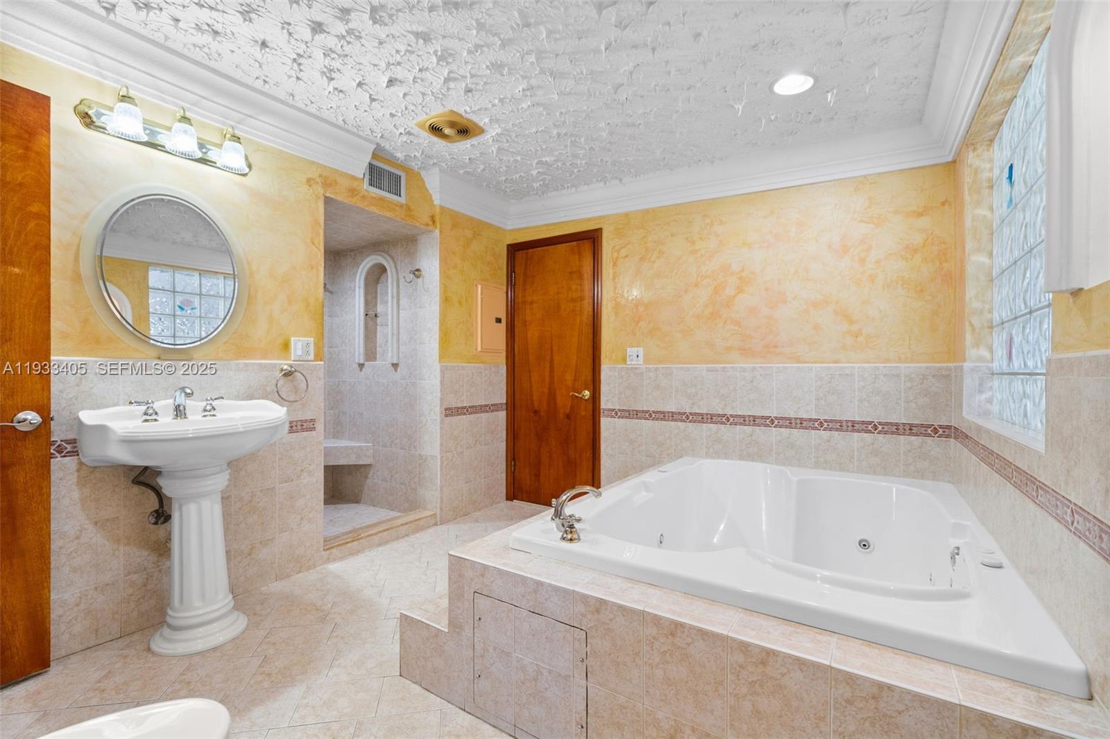 11620 Southwest 179th Terrace Miami, FL 33157 - Photo 18 of 25 a bathroom with a sink a toilet and shower