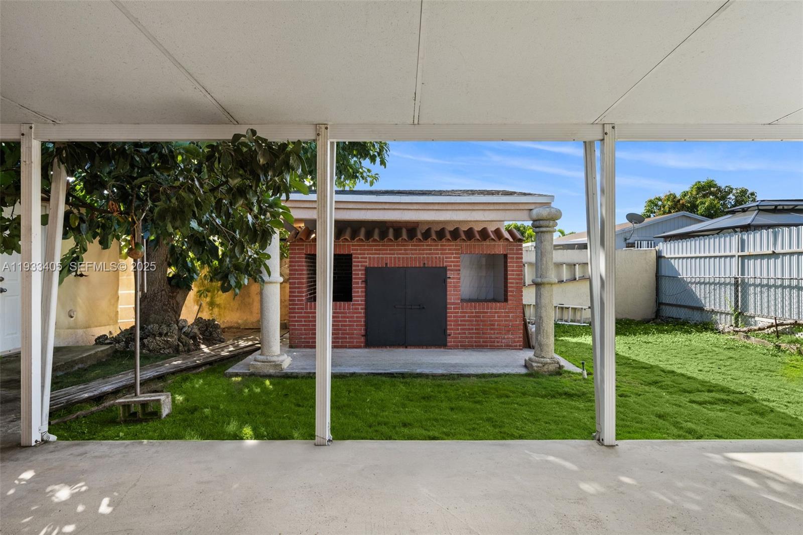11620 Southwest 179th Terrace Miami, FL 33157 - Photo 23 of 25 a front view of a house with garden