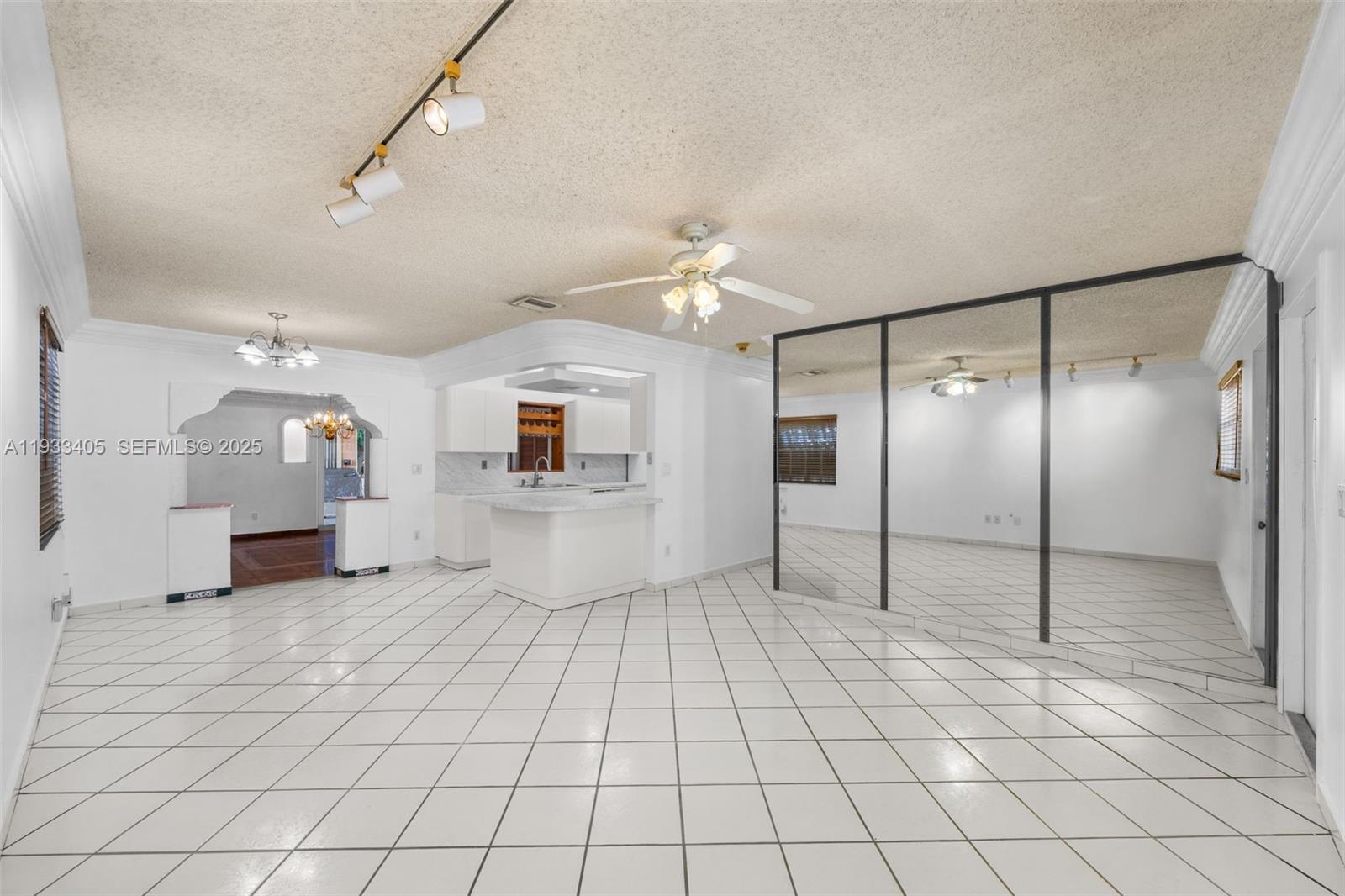 11620 Southwest 179th Terrace Miami, FL 33157 - Photo 5 of 25 a spacious bathroom with a shower a mirror and a shower