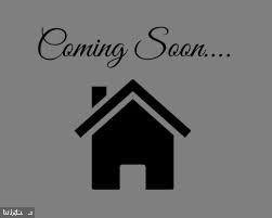 a view of a hallway with rack on the wall