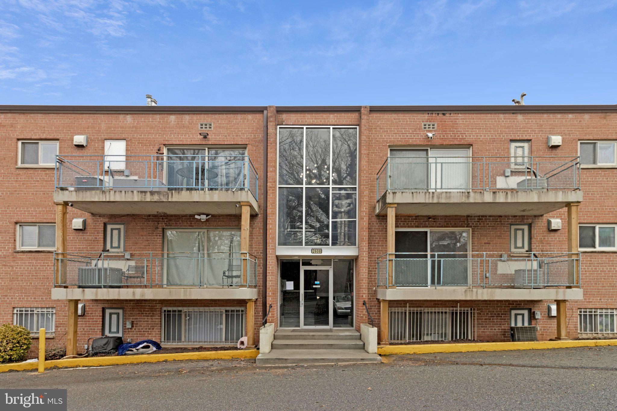 a front view of a building with a street