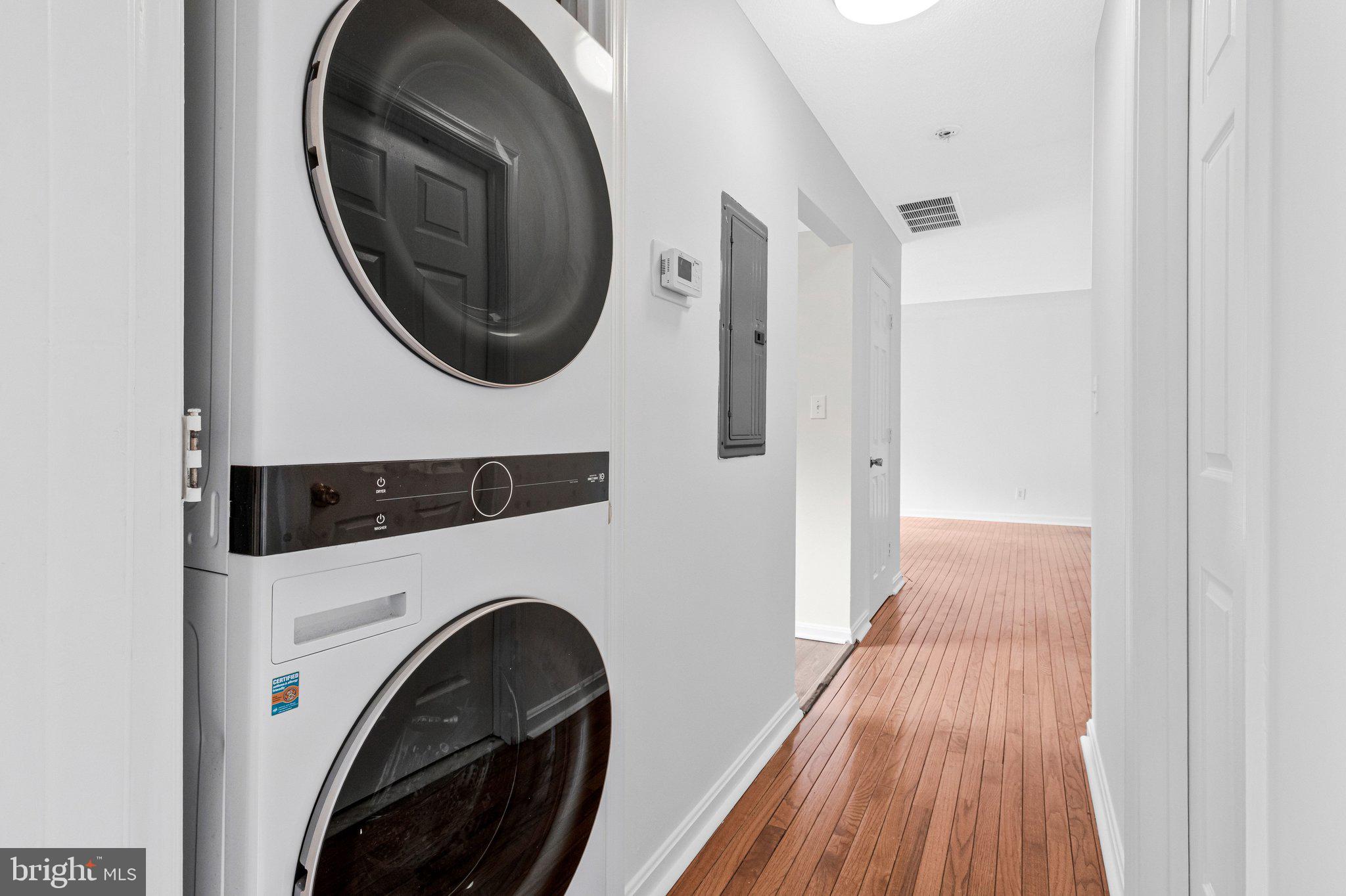 2608 Wade Road Southeast, Unit 202 Washington, DC 20020 - Photo 12 of 25 a view of a hallway with washer and dryer